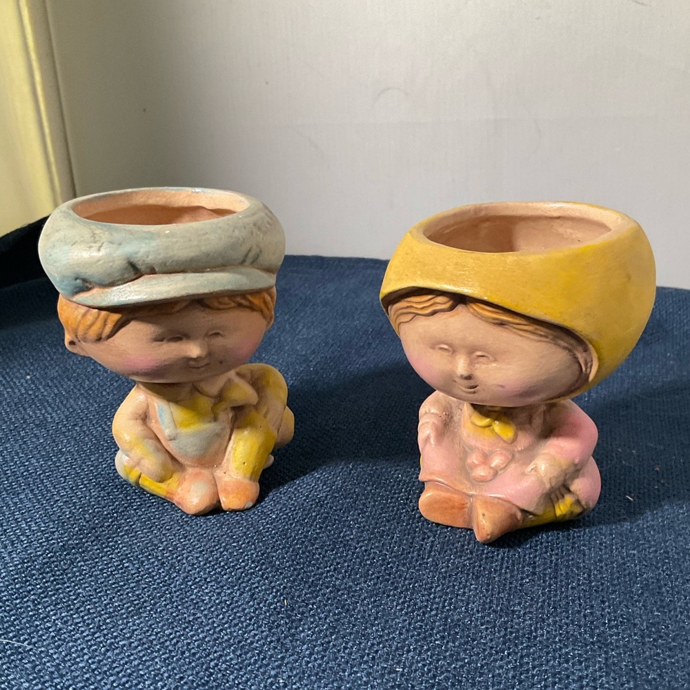 Vintage Ceramic Amish girl baker with buns in her apron and a boy candle/planter